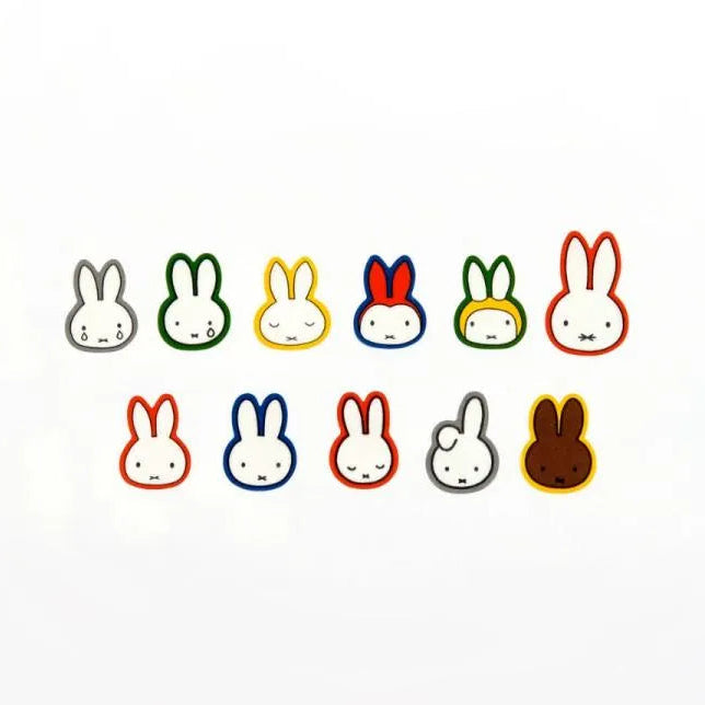 Colorful miffy character faces on a white background